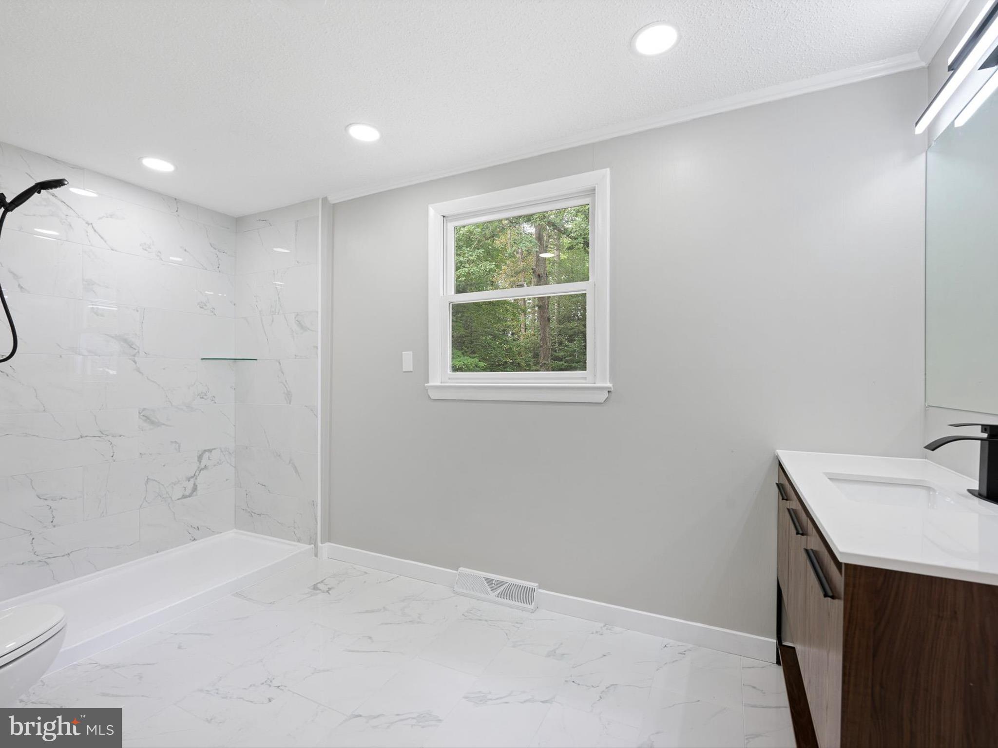 22832 Angola Road East Lewes, DE 19958 - Photo 26 of 43 a bathroom with a sink and a bathtub