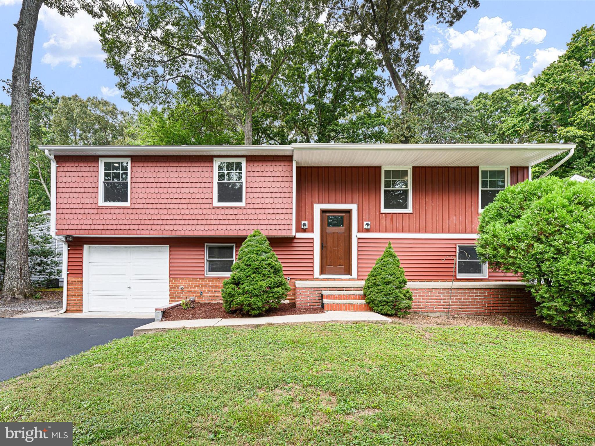 22832 Angola Road East Lewes, DE 19958 - Photo 35 of 43 front view of a house with a yard