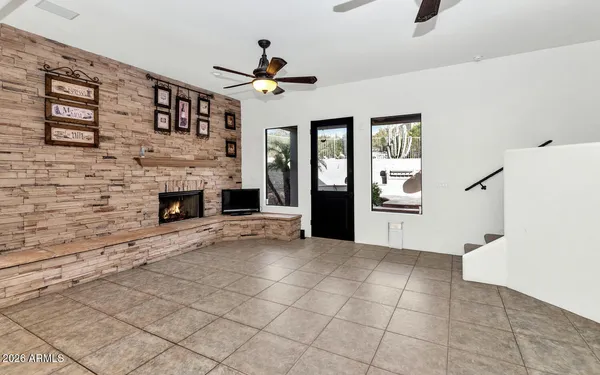 a view of an empty room with a fireplace