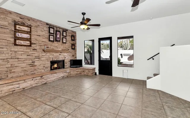 a view of an empty room with a fireplace