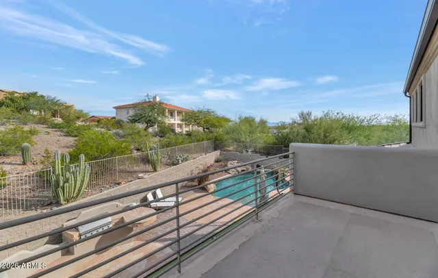 a view of a balcony with an outdoor seating