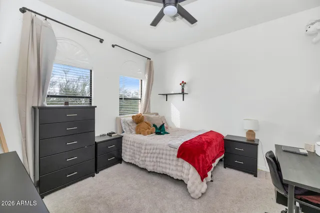 a bedroom with a bed and window