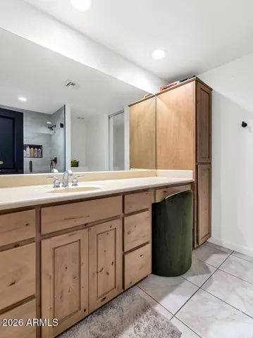 a bathroom with a double vanity sink and a mirror