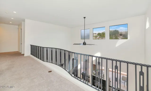 a view of hallway with chandelier
