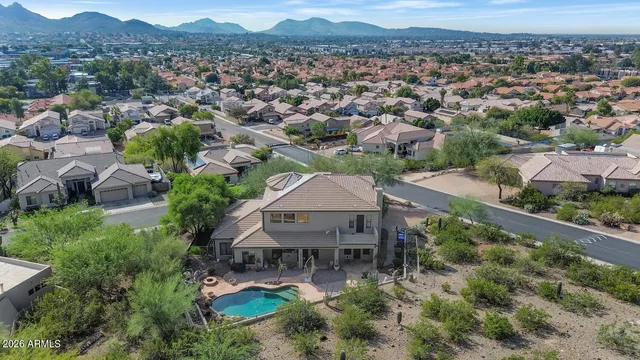an aerial view of a house with a garden