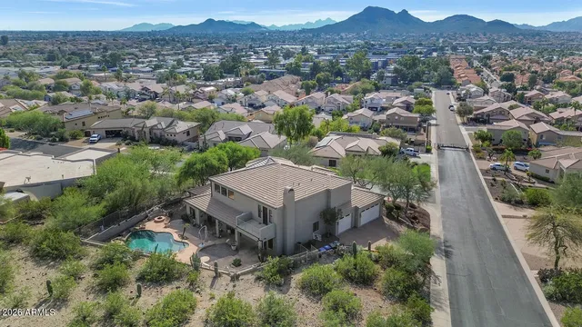 an aerial view of a house with a garden