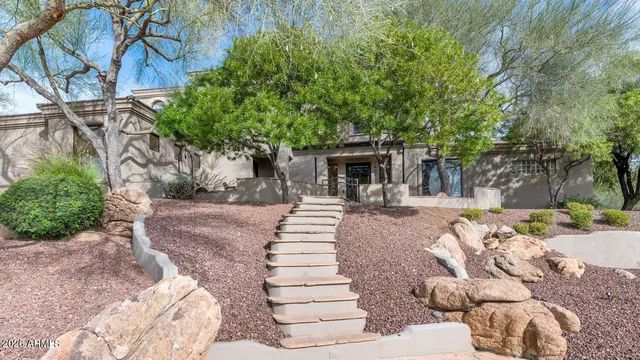 a view of a backyard with sitting area