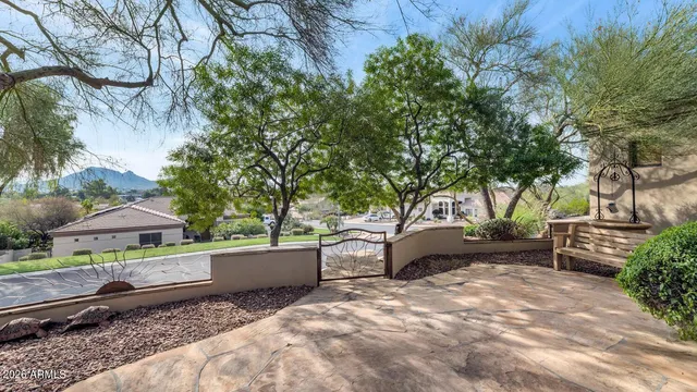 a view of a house with backyard and sitting area