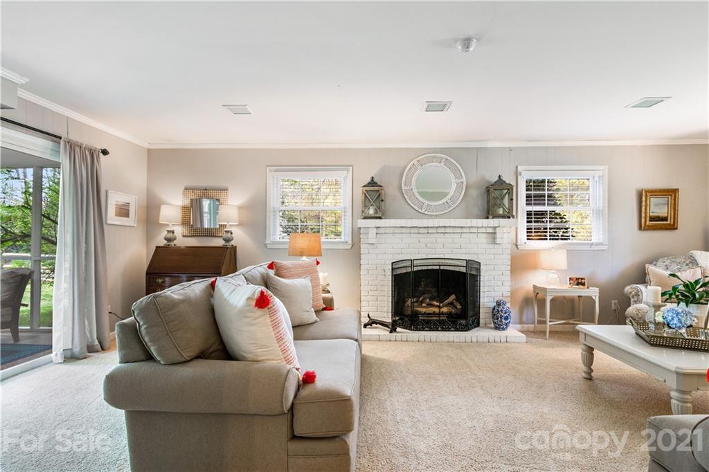 3018 Goneaway Road Charlotte, NC 28210 - Photo 12 of 35 a living room with furniture and a fireplace