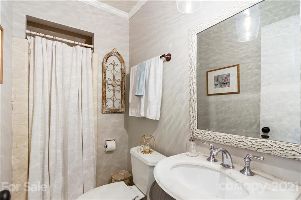 3018 Goneaway Road Charlotte, NC 28210 - Photo 15 of 35 a bathroom with a sink and a mirror