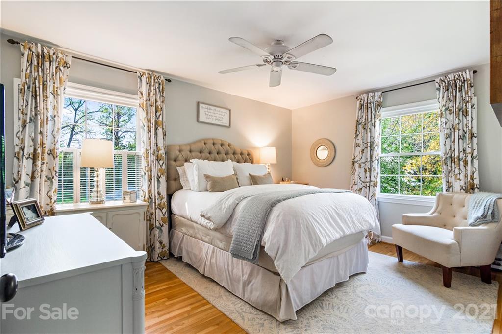 3018 Goneaway Road Charlotte, NC 28210 - Photo 16 of 35 a bedroom with a bed and glass window