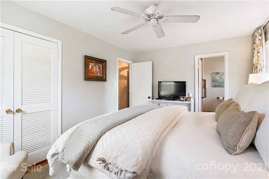 3018 Goneaway Road Charlotte, NC 28210 - Photo 17 of 35 a bedroom with a bed and a tv