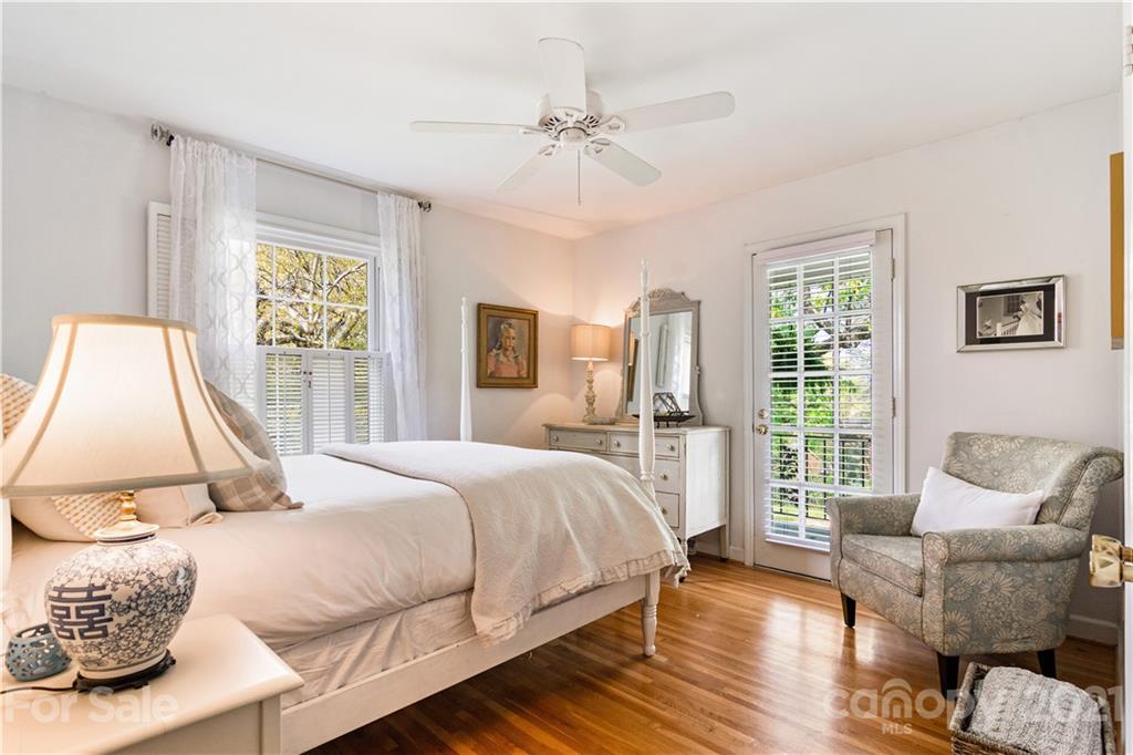 3018 Goneaway Road Charlotte, NC 28210 - Photo 20 of 35 a bedroom with a bed and wooden floor