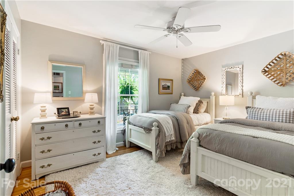 3018 Goneaway Road Charlotte, NC 28210 - Photo 22 of 35 a bedroom with two beds and a dresser