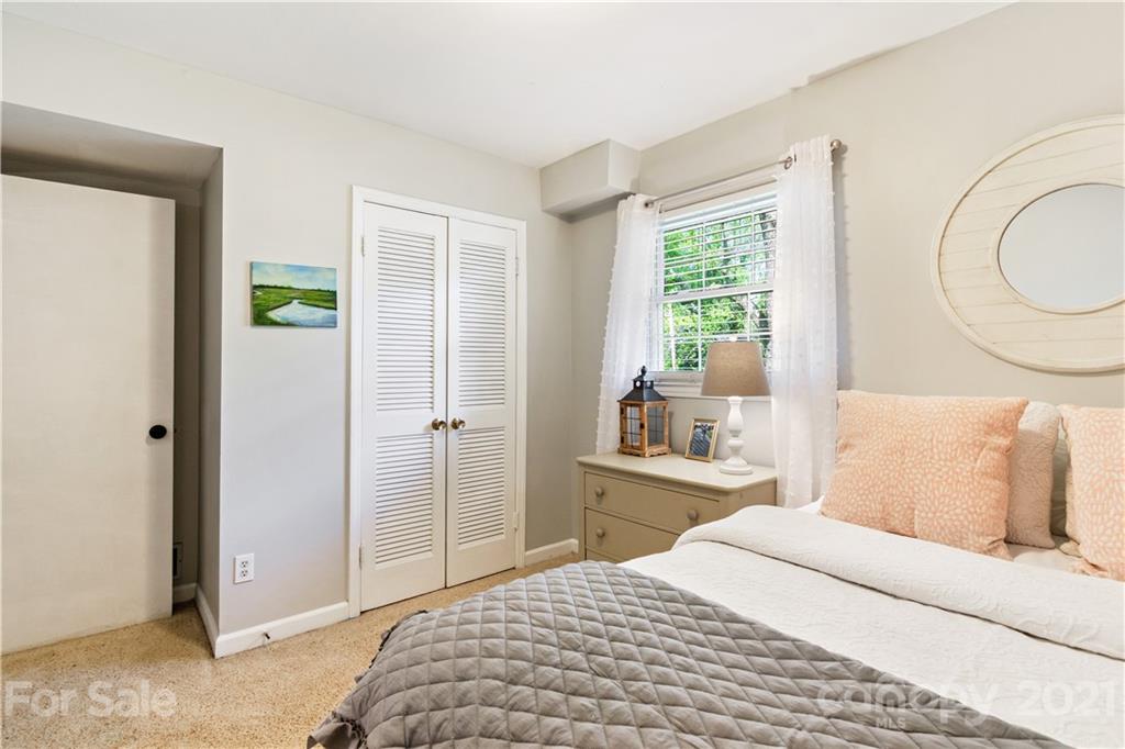 3018 Goneaway Road Charlotte, NC 28210 - Photo 25 of 35 a bedroom with a bed and a window