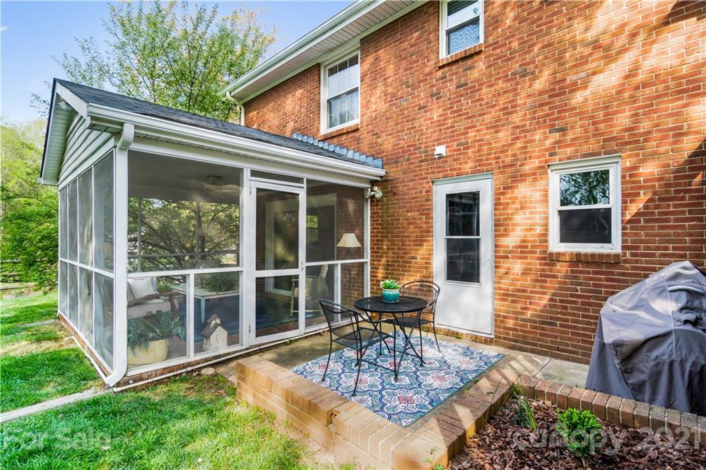 3018 Goneaway Road Charlotte, NC 28210 - Photo 27 of 35 a view of house with backyard outdoor seating and green space