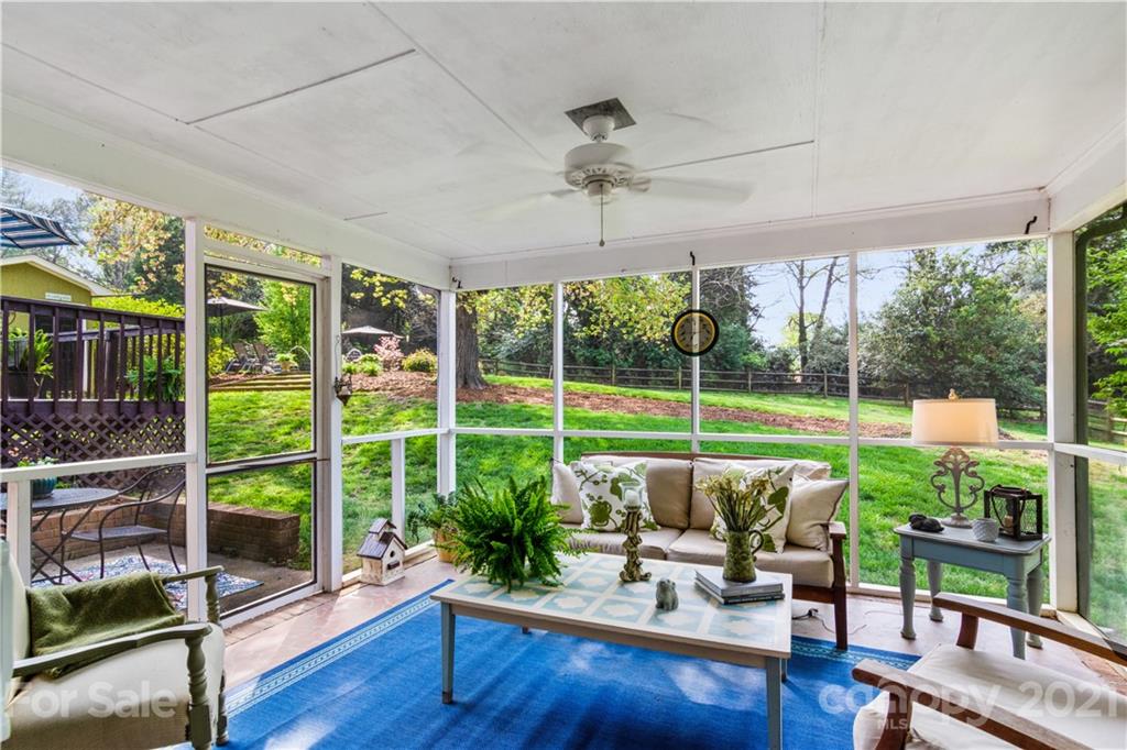 3018 Goneaway Road Charlotte, NC 28210 - Photo 28 of 35 a view of a porch with furniture and wooden floor