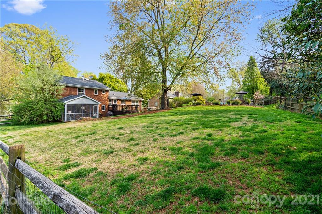 3018 Goneaway Road Charlotte, NC 28210 - Photo 32 of 35 a view of a house with a big yard and large trees