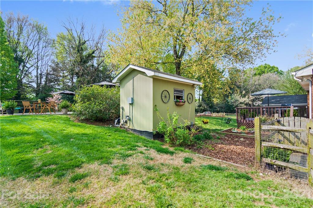3018 Goneaway Road Charlotte, NC 28210 - Photo 34 of 35 a view of a backyard with plants and large trees