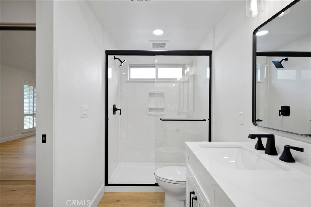 5408 Hanover Drive Cypress, CA 90630 - Photo 18 of 33 a bathroom with a sink a toilet and shower