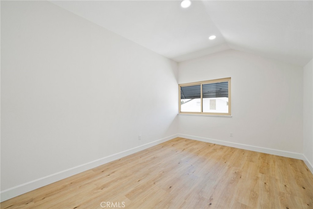 5408 Hanover Drive Cypress, CA 90630 - Photo 23 of 33 an empty room with wooden floor and windows