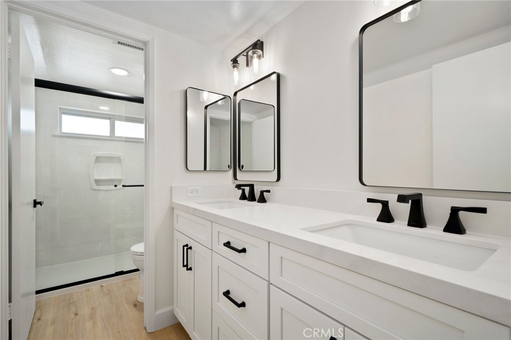 5408 Hanover Drive Cypress, CA 90630 - Photo 25 of 33 a bathroom with a double vanity sink mirror and