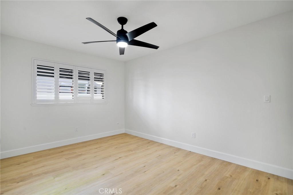 5408 Hanover Drive Cypress, CA 90630 - Photo 27 of 33 an empty room with wooden floor and windows