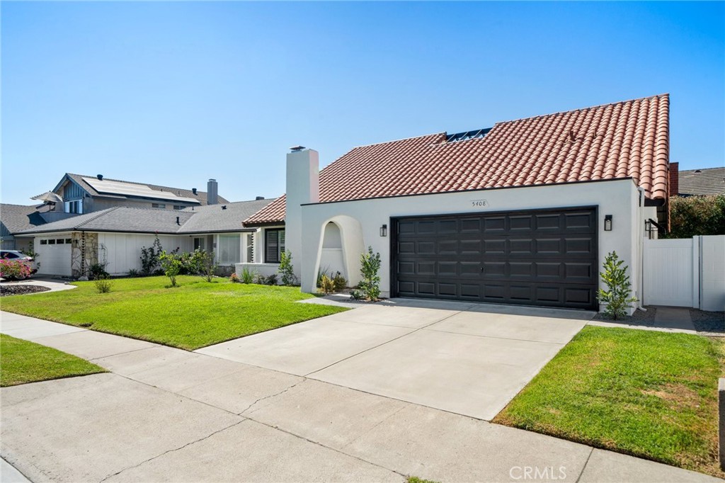 5408 Hanover Drive Cypress, CA 90630 - Photo 3 of 33 a front view of a house with a yard and garage