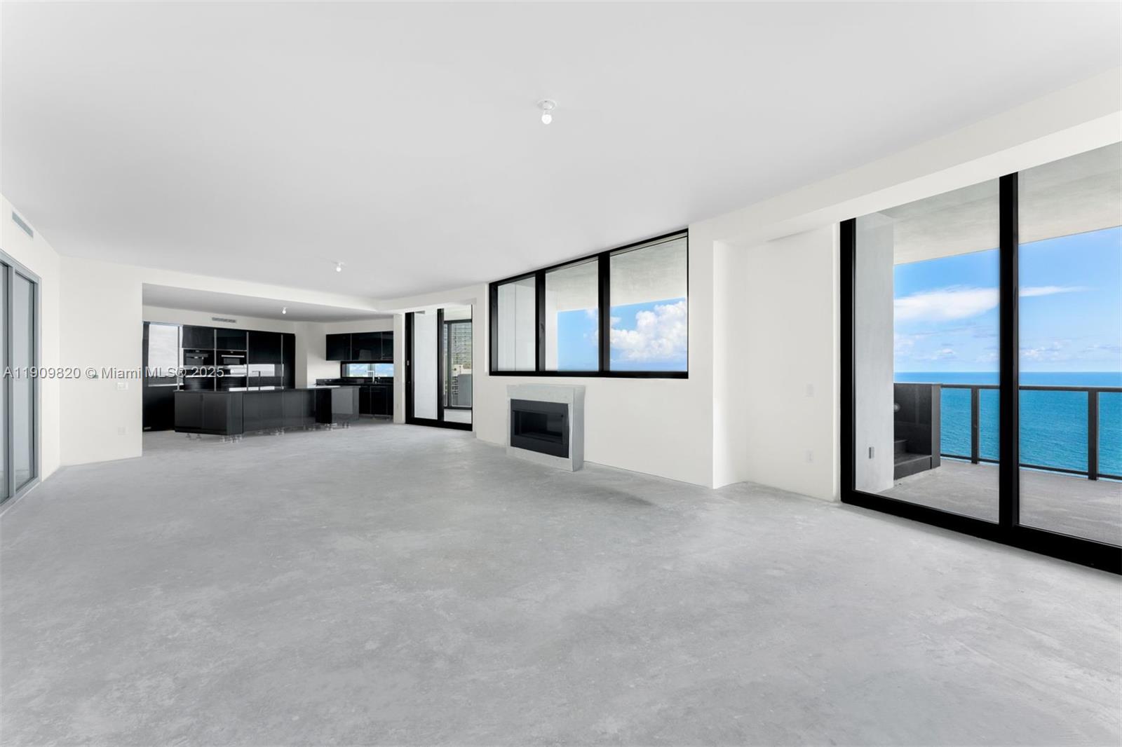 18555 Collins Avenue, Unit 3205 Sunny Isles Beach, FL 33160 - Photo 16 of 50 a view of a livingroom with furniture and kitchen