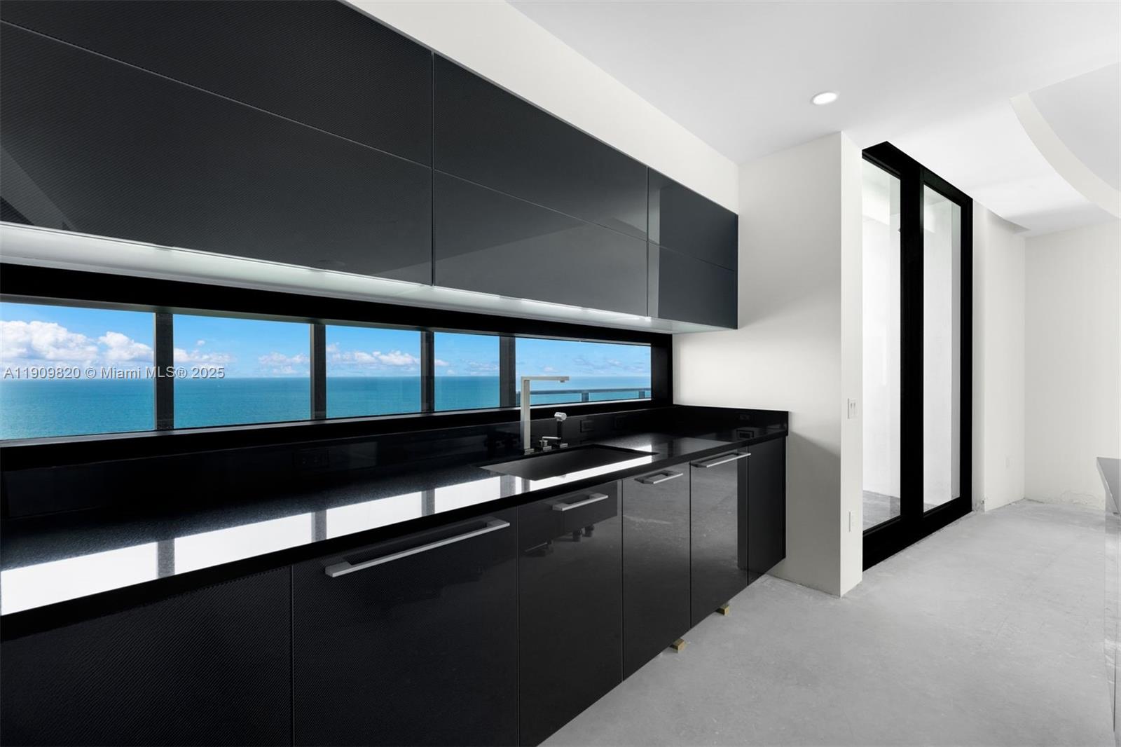 18555 Collins Avenue, Unit 3205 Sunny Isles Beach, FL 33160 - Photo 20 of 50 a view of kitchen with stainless steel appliances a sink and wooden floor