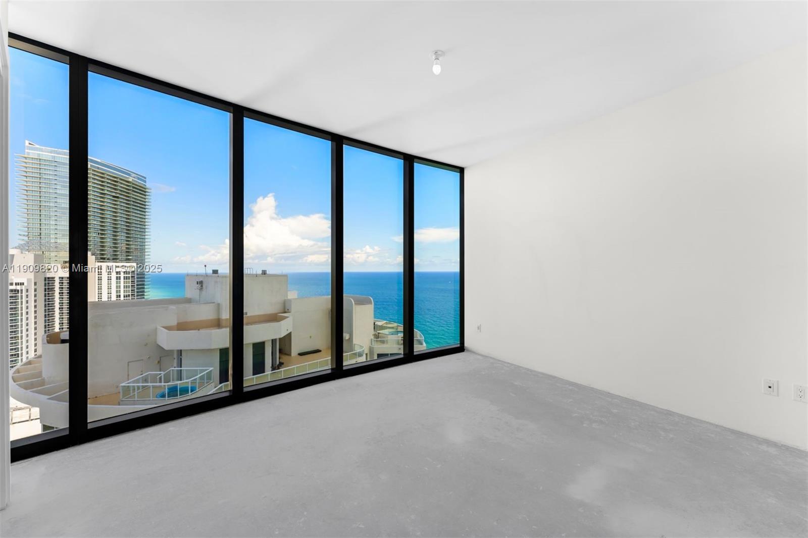 18555 Collins Avenue, Unit 3205 Sunny Isles Beach, FL 33160 - Photo 29 of 50 a view of an empty room with window