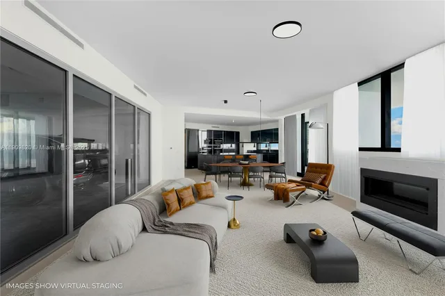 a living room with furniture gym equipment and a fireplace