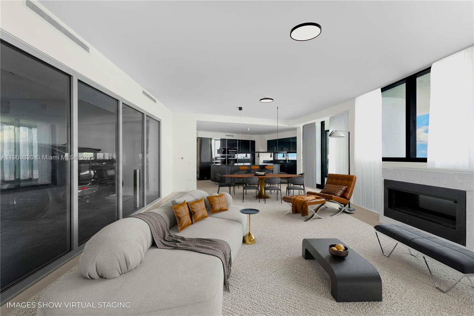 18555 Collins Avenue, Unit 3205 Sunny Isles Beach, FL 33160 - Photo 4 of 50 a living room with furniture gym equipment and a fireplace