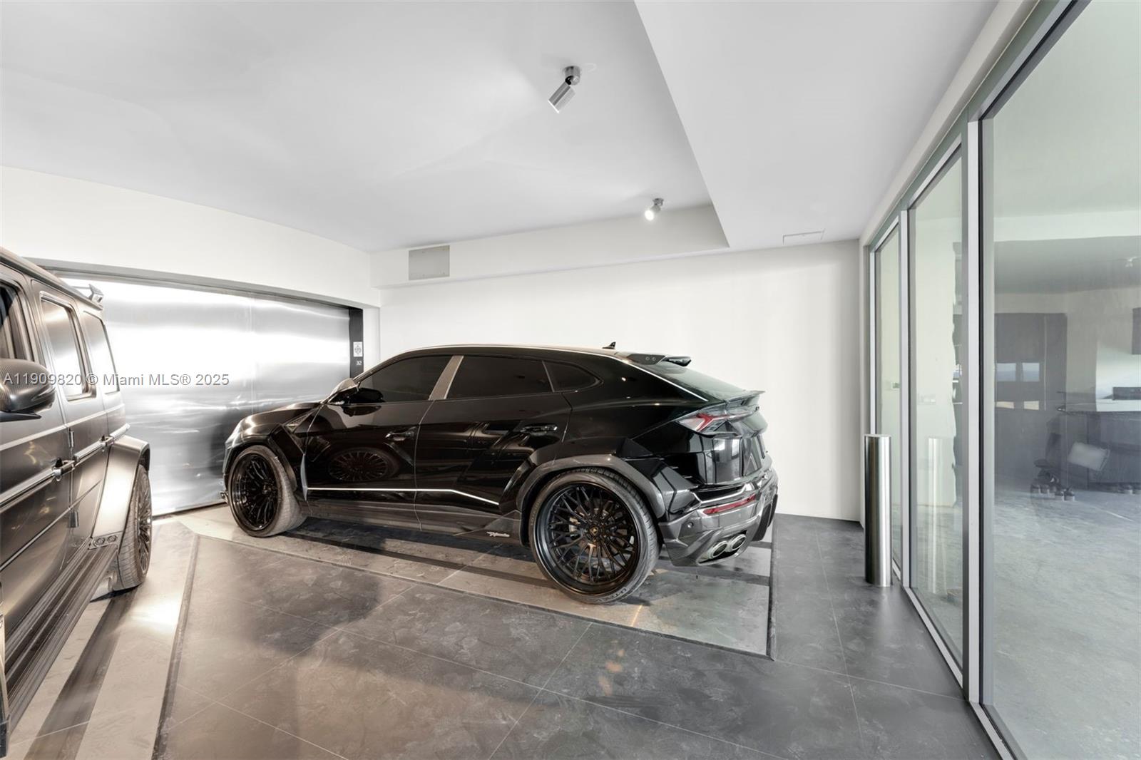18555 Collins Avenue, Unit 3205 Sunny Isles Beach, FL 33160 - Photo 47 of 50 a car parked in a garage