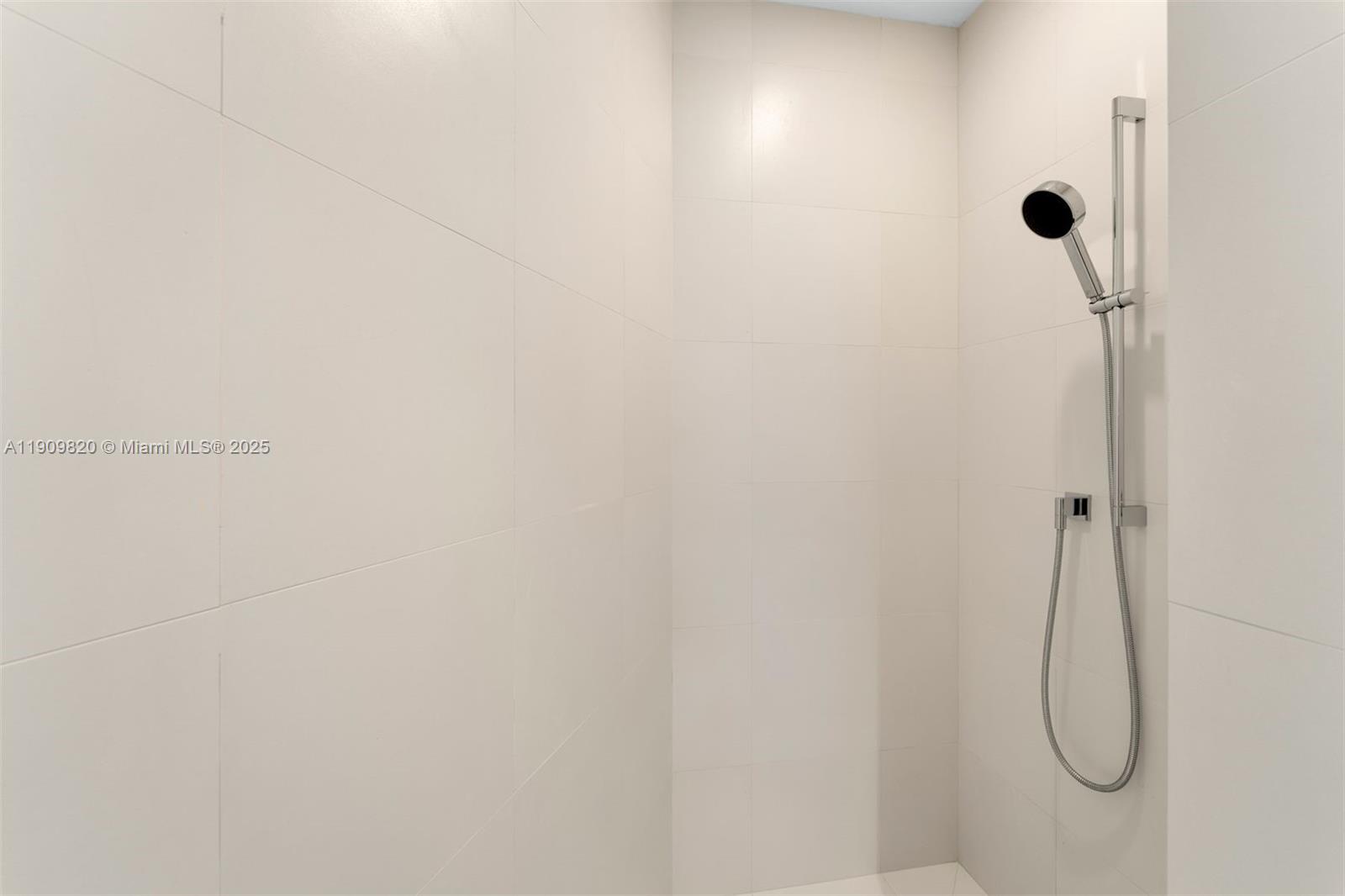 18555 Collins Avenue, Unit 3205 Sunny Isles Beach, FL 33160 - Photo 49 of 50 a bathroom with a shower