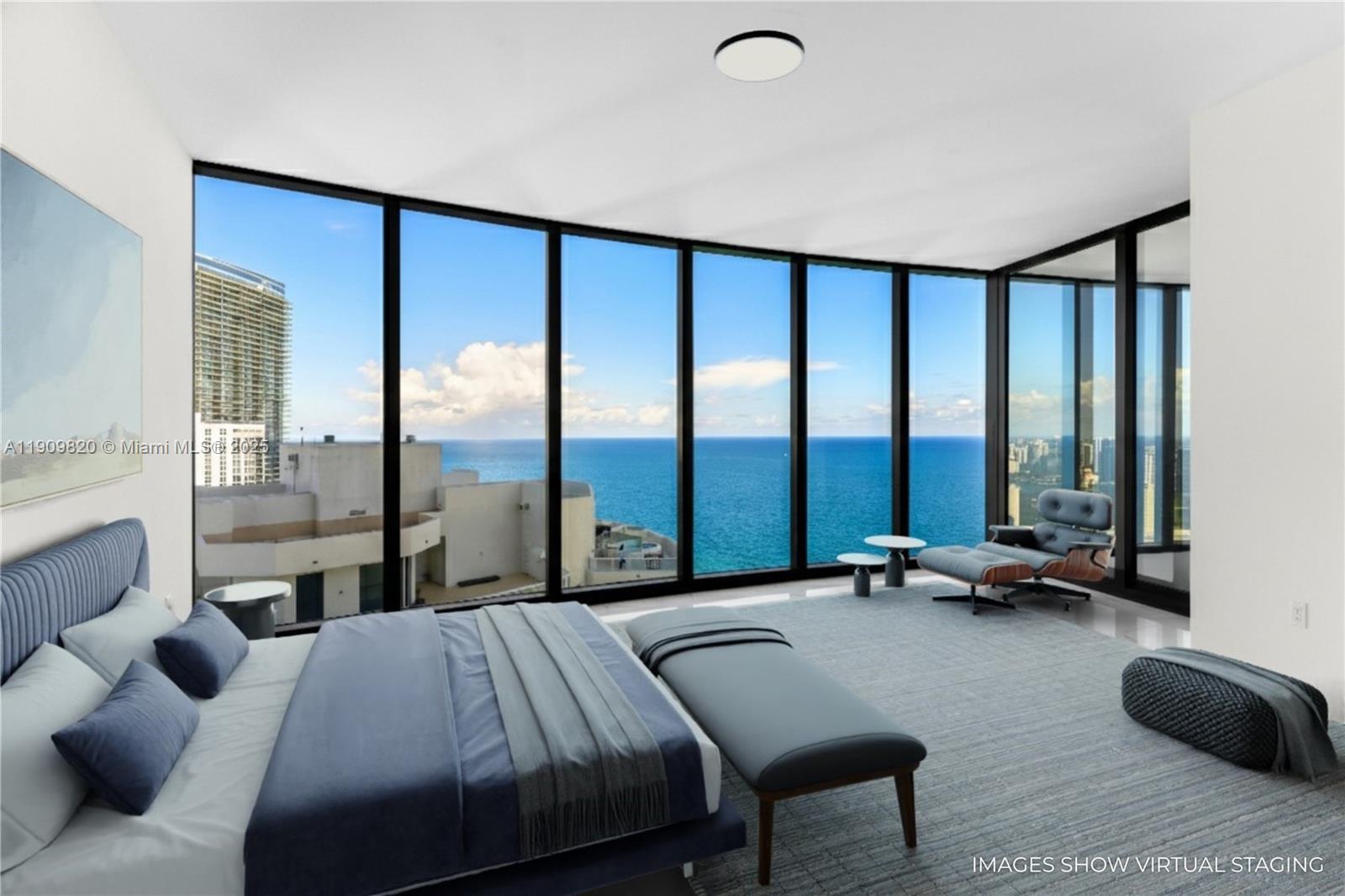 18555 Collins Avenue, Unit 3205 Sunny Isles Beach, FL 33160 - Photo 10 of 50 a bedroom with a bed and a large window