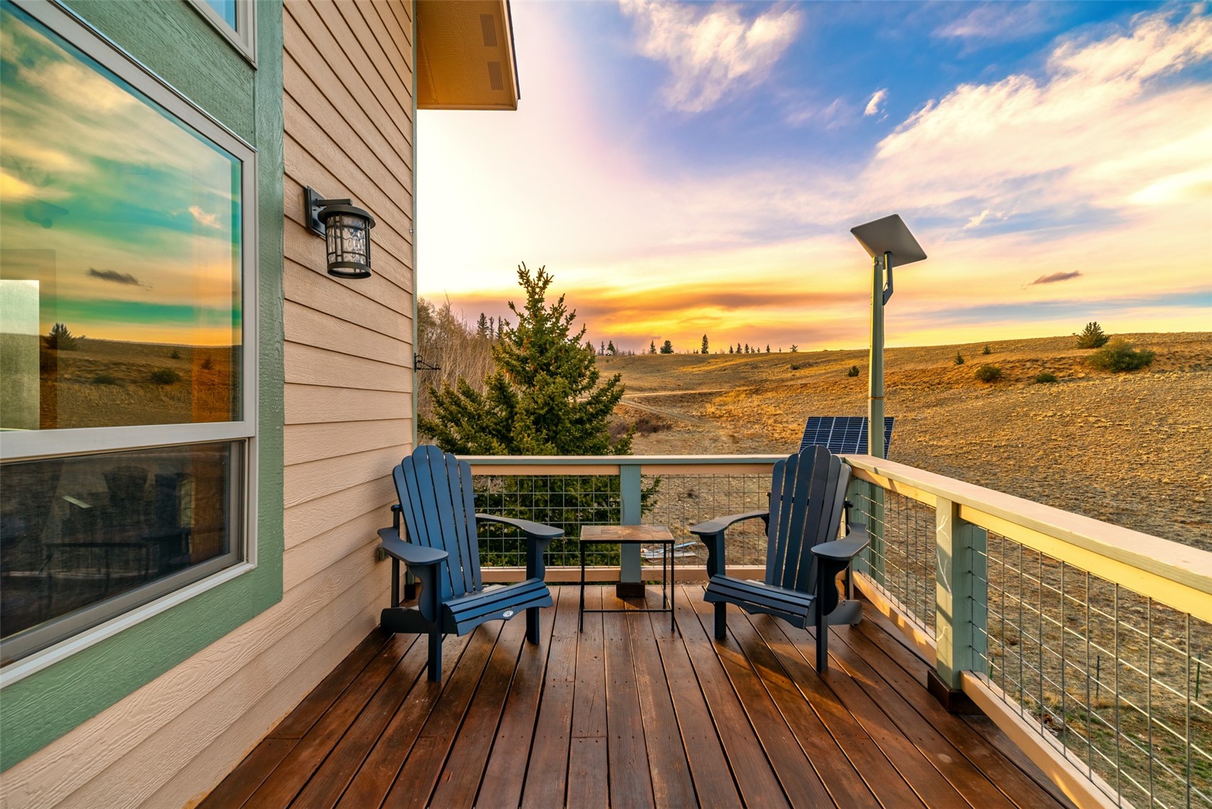 440 Arland Road Como, CO 80432 - Photo 3 of 49 a view of a balcony with chairs and wooden floor