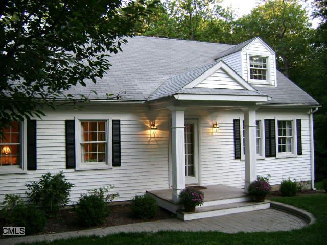 97 Bob Hill Road Ridgefield, CT 06877 - Photo 1 of 1 a front view of a house with a yard and garage
