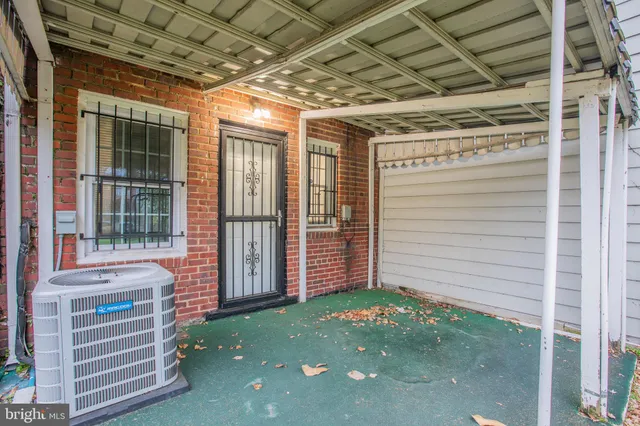 a view of a yard with a house and large trees