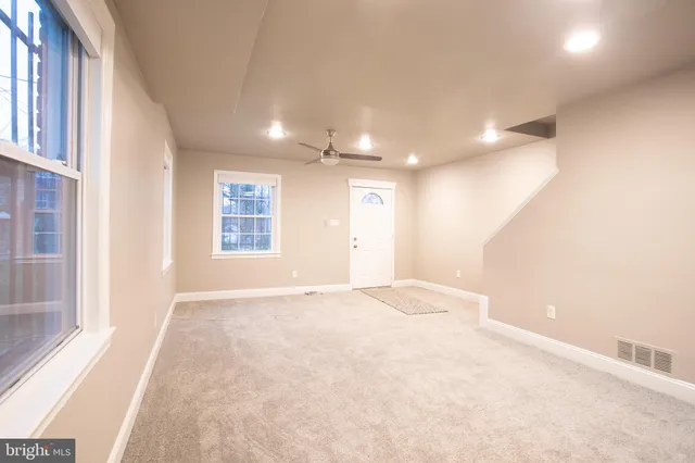 a view of an empty room with a window