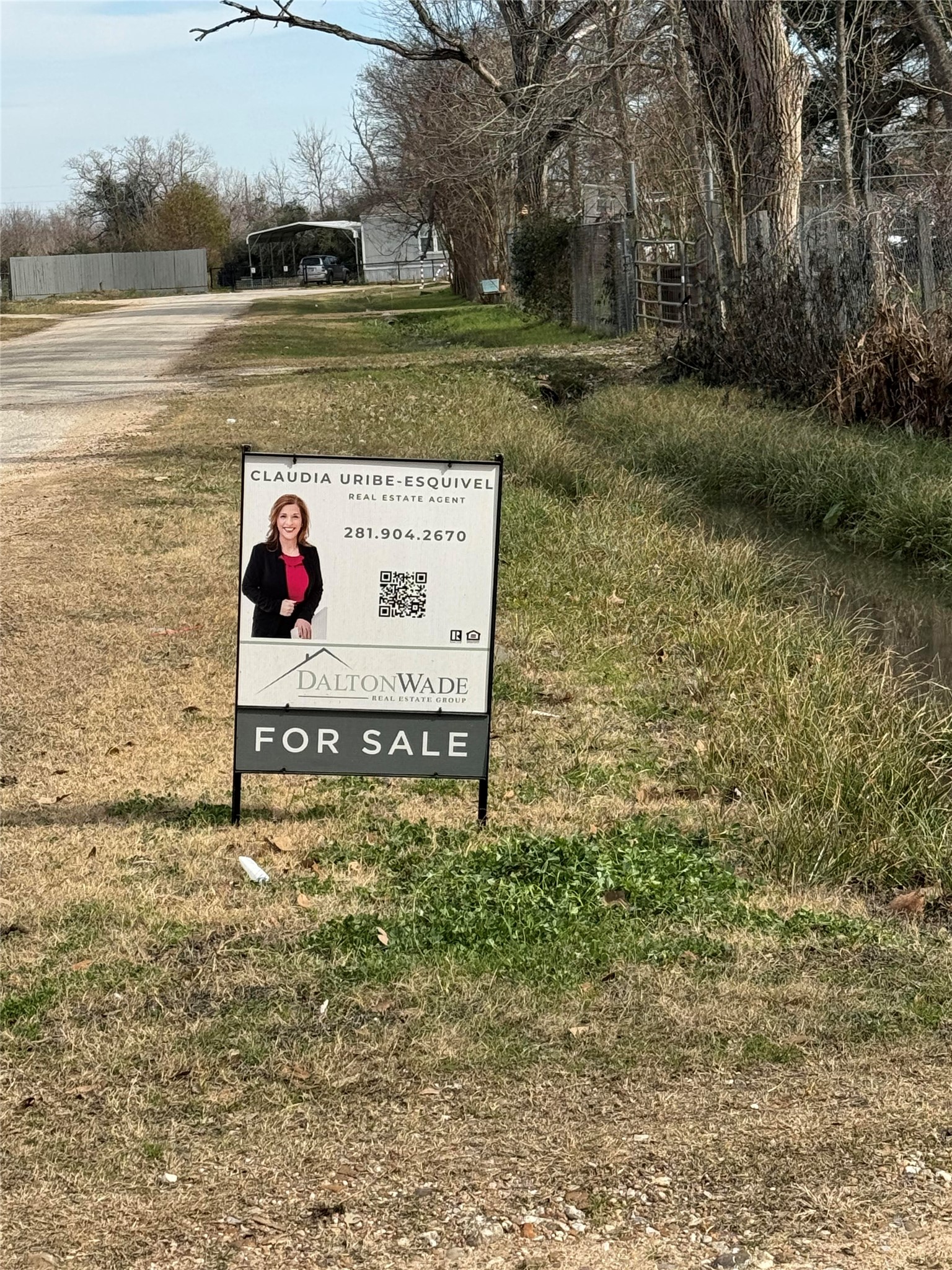 22203 Sandspoint Drive Katy, TX 77449 - Photo 6 of 7 a view of a wooden fence and lake view