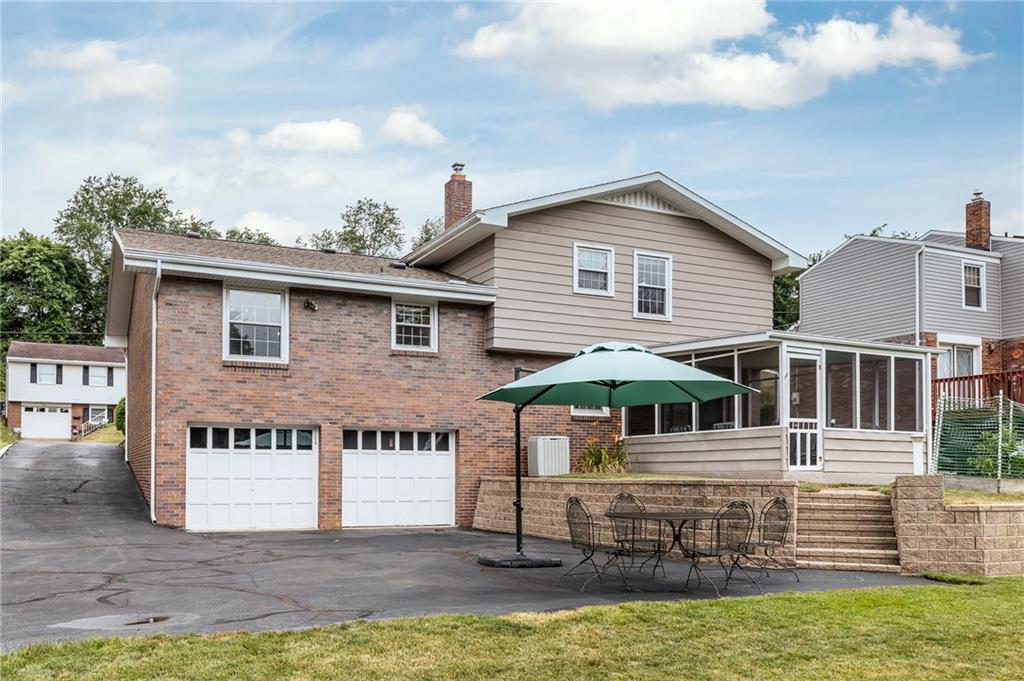 209 Foxcroft Road Pittsburgh, PA 15220 - Photo 23 of 24 Back of the house with a two car garage