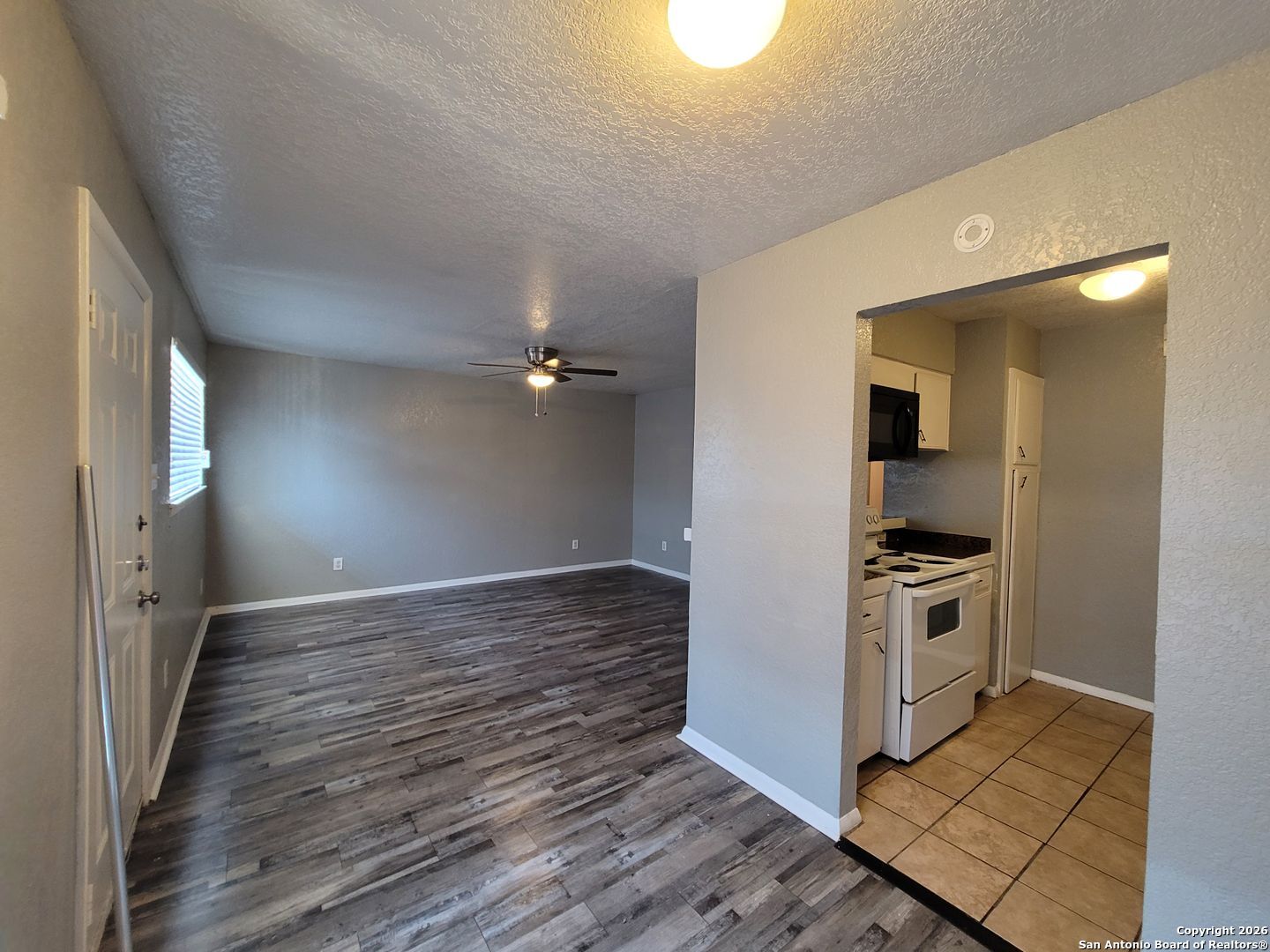 516 Gentleman Road, Unit 17 Balcones Heights, TX 78201 - Photo 1 of 29 a view of a kitchen with a stove cabinets and wooden floor