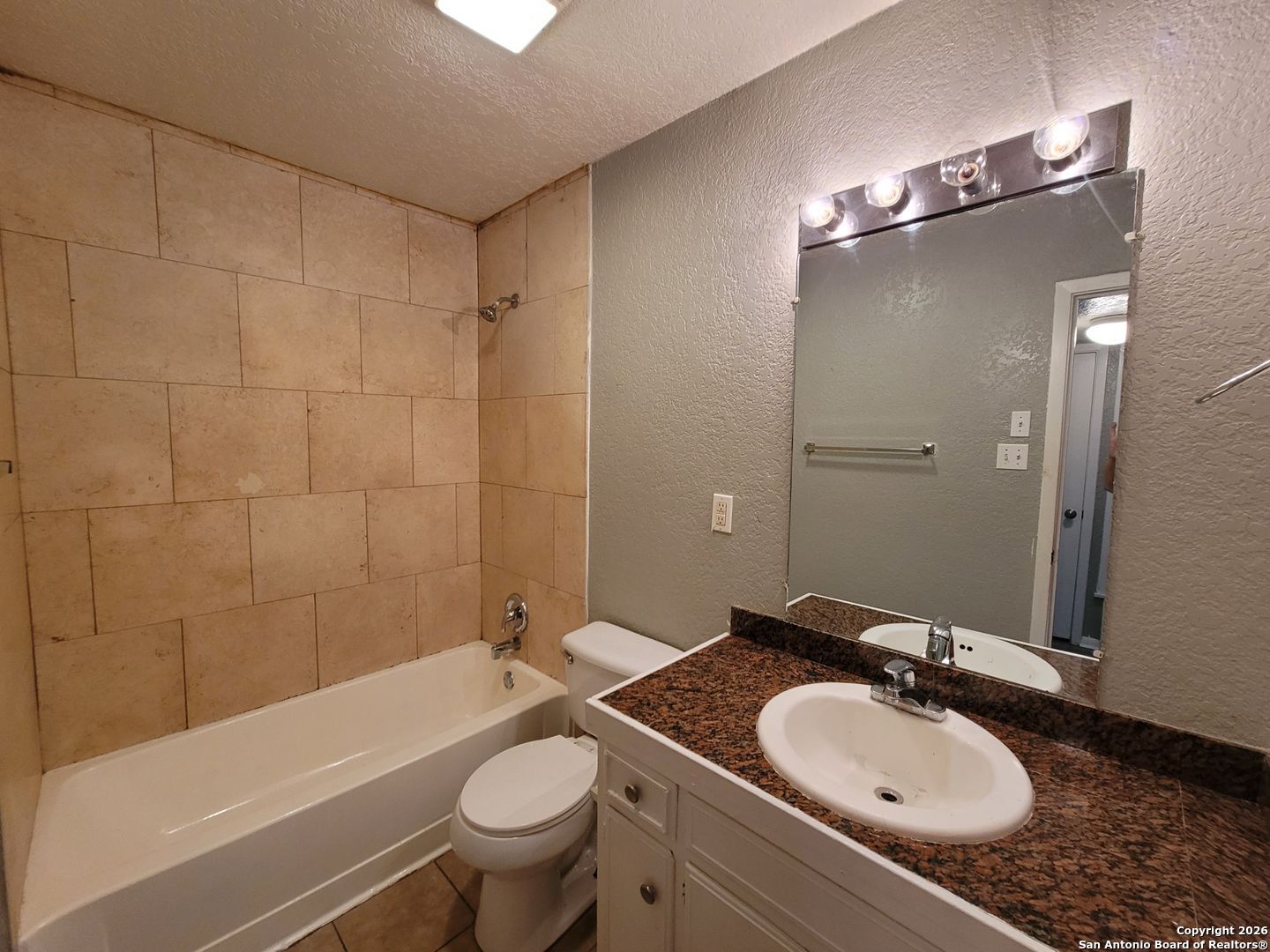 516 Gentleman Road, Unit 17 Balcones Heights, TX 78201 - Photo 6 of 29 a bathroom with a sink toilet tub and shower