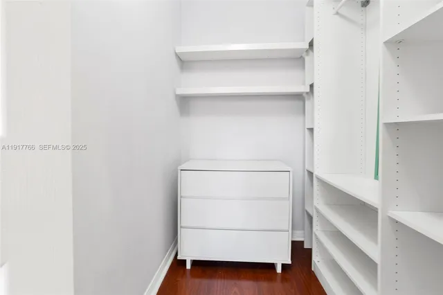 a view of an empty walk in closet