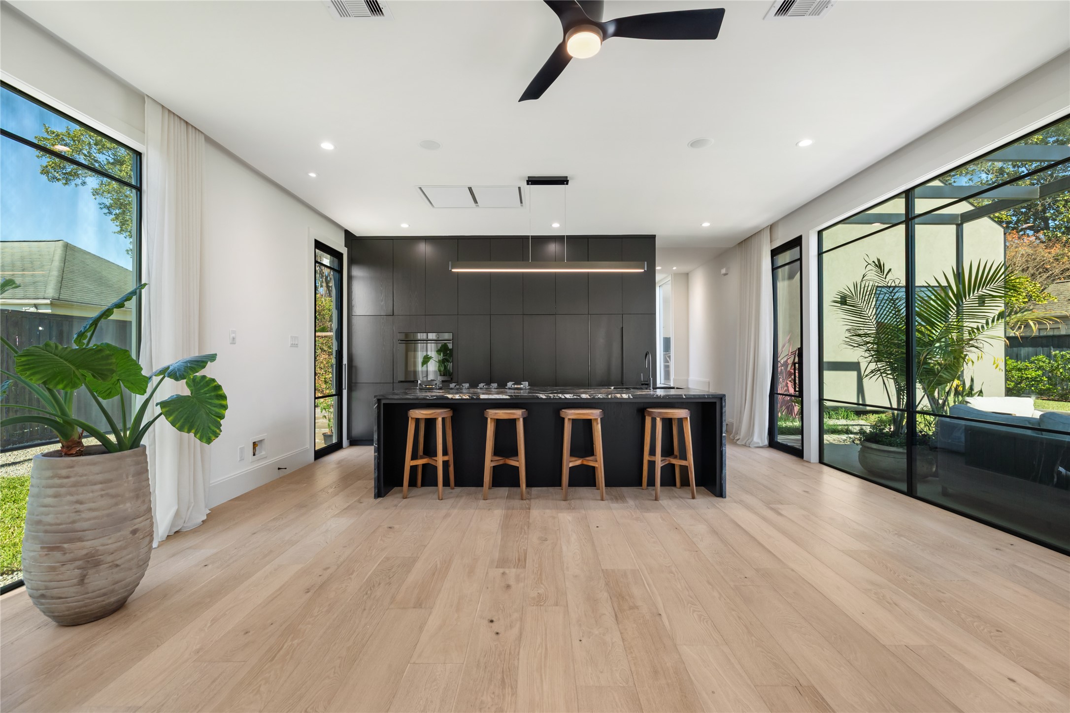 419 West 30th Street Houston, TX 77018 - Photo 15 of 45 a open kitchen with kitchen island and a view of living room