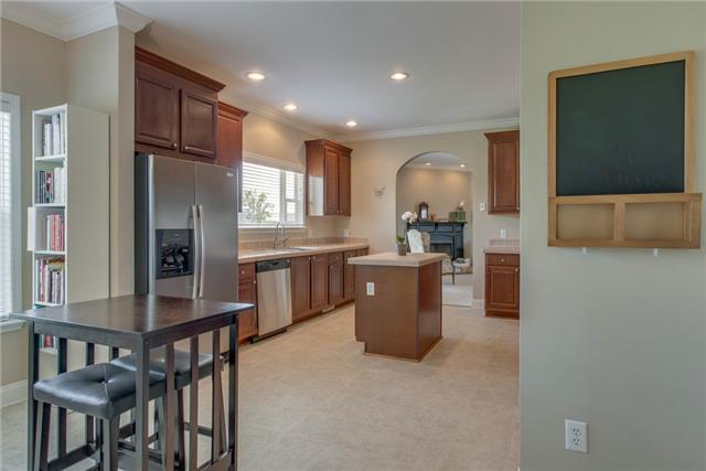 2250 Clara Mathis Road Spring Hill, TN 37174 - Photo 6 of 20 a view of kitchen with kitchen island stainless steel appliances refrigerator stove microwave and cabinets