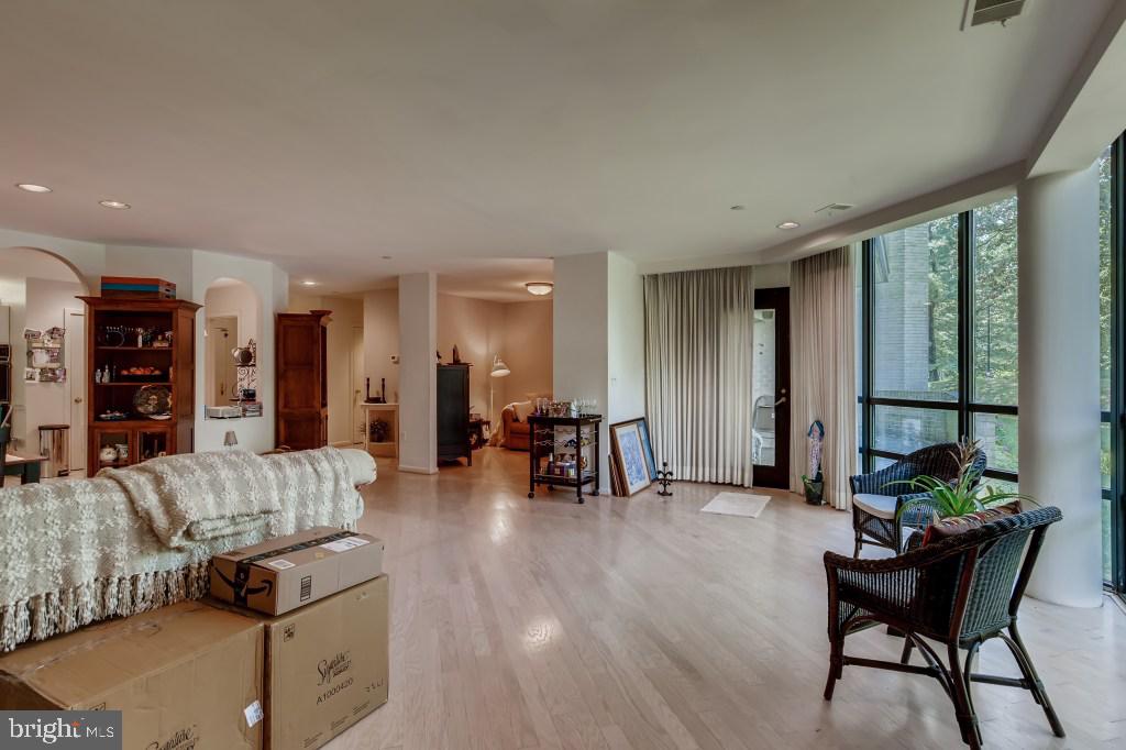 4001 Old Court Road, Unit 101 Pikesville, MD 21208 - Photo 11 of 27 LIVING ROOM OPENS TO DEN