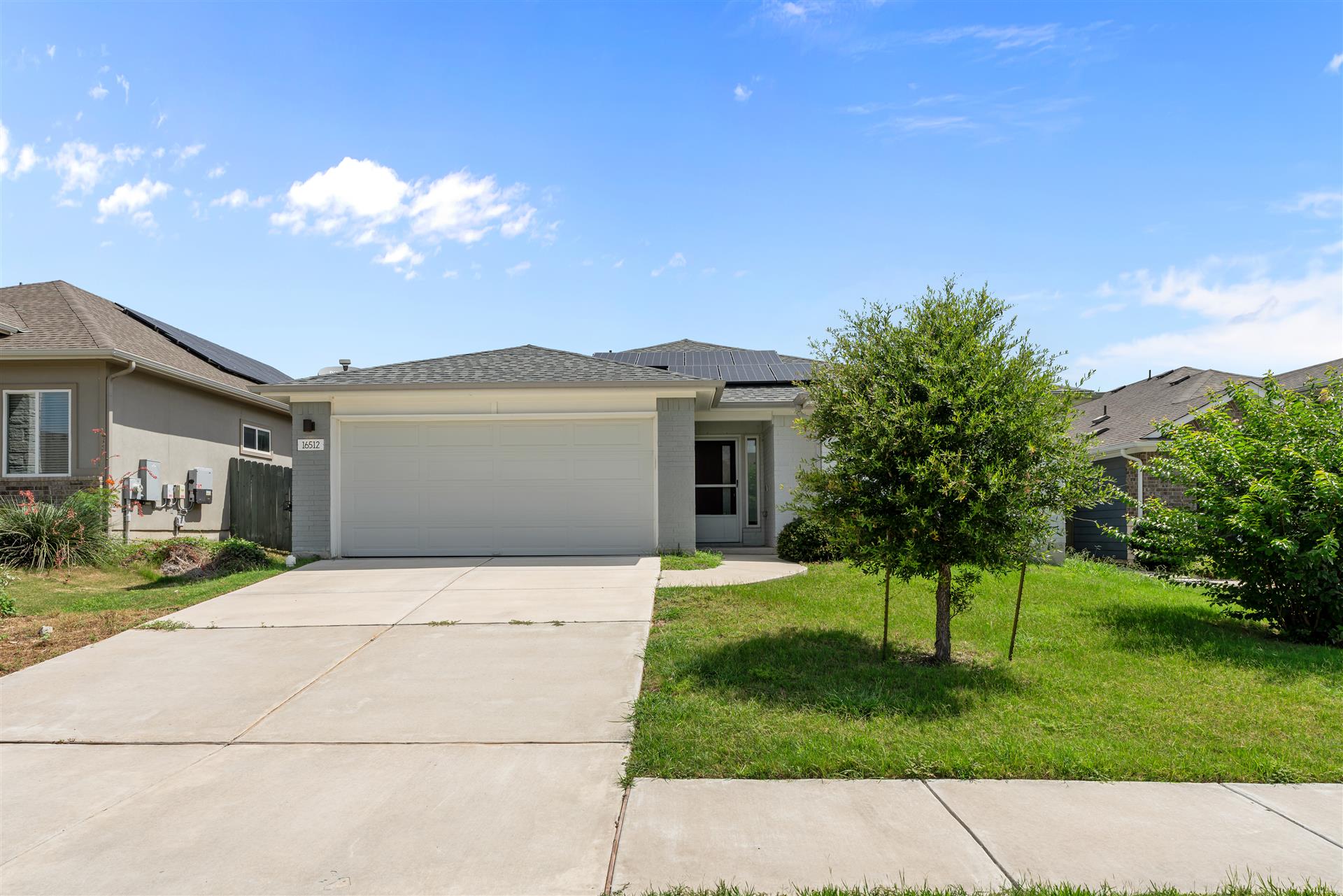 16512 Enamorado Road Manor, TX 78653 - Photo 1 of 31 A charming single-story residence with an attached garage offers inviting curb appeal.