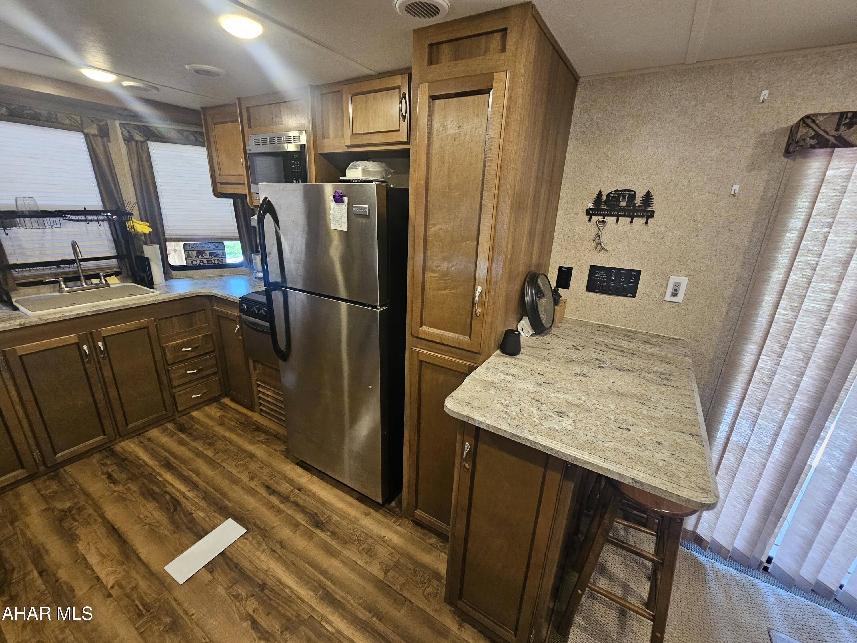 137 Mimosa Circle Flinton, PA 16640 - Photo 15 of 18 a kitchen with refrigerator and countertop
